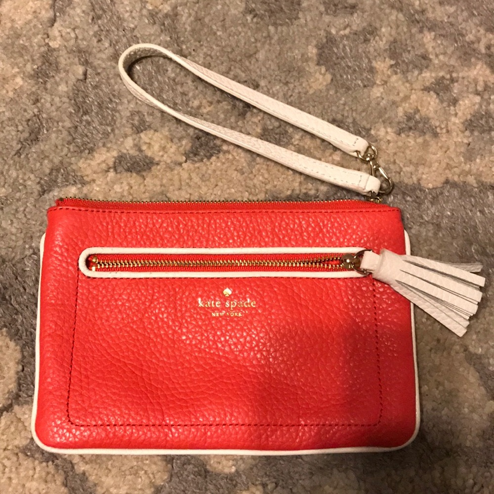 Coral in color Kate Spade wristlet